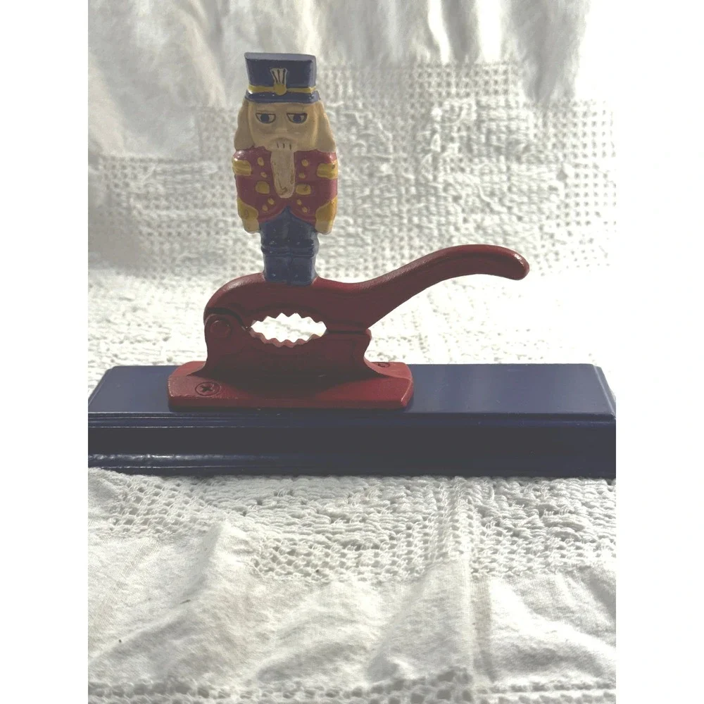 Vintage Cast Iron Nutcracker Soldier on Wood Base Red Blue Christmas Decor